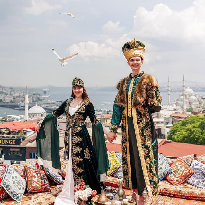 Tourist-posing-in-sultan-dress-on-rooftop.jpg